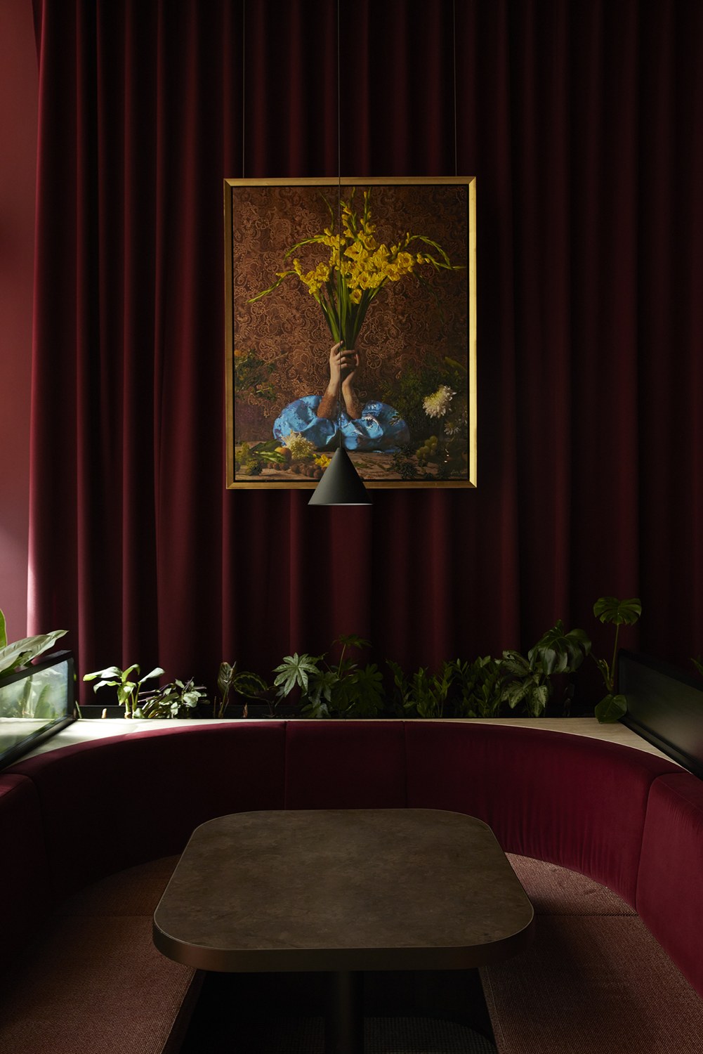 Yellow Gladiolus by Violeta Sofia, hung against a deep red curtain at Winston Taylor, London